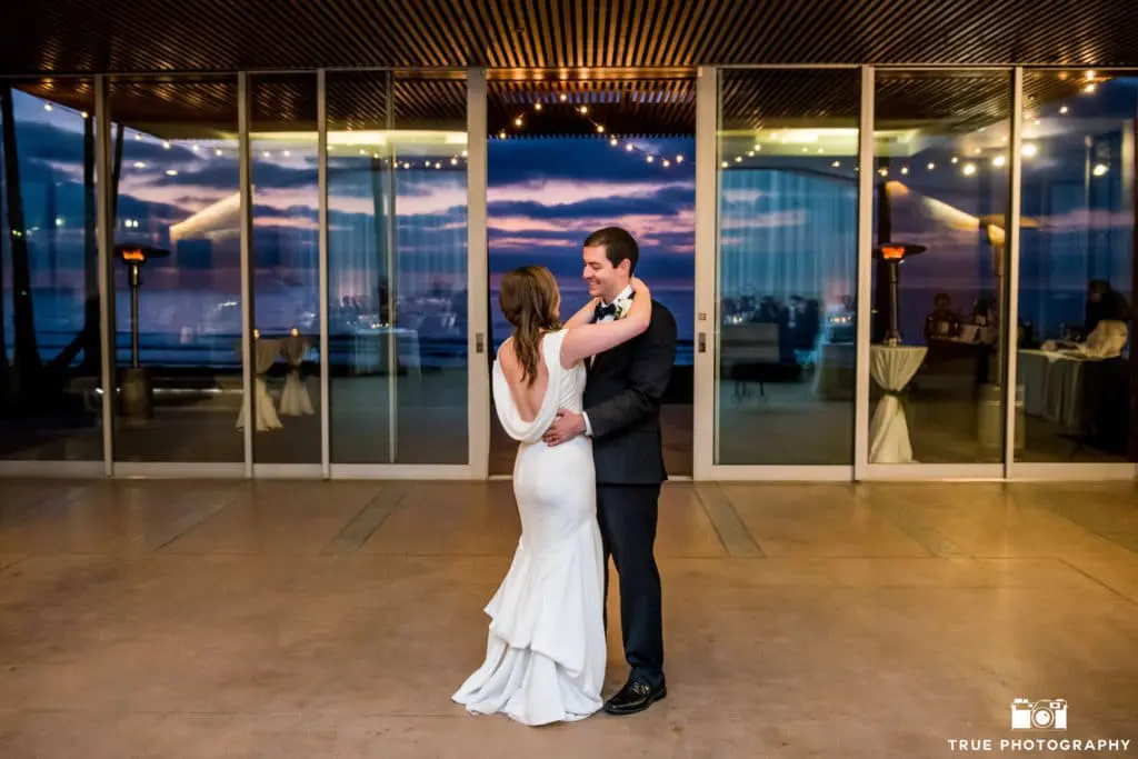 Shortly following the Grand Entrance, the First Dance was back-lit by an incredible lavender sky beach sunset.