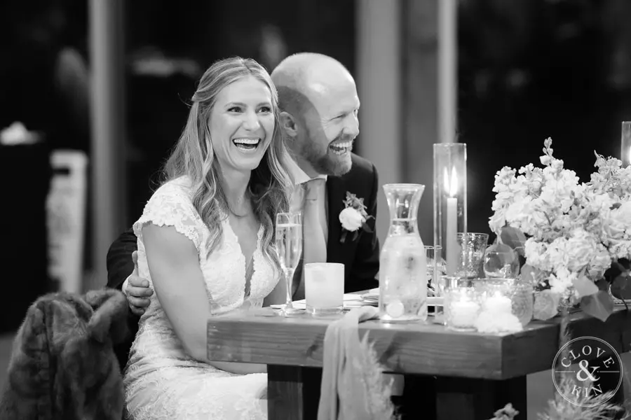 Bride and Groom laugh during toasts